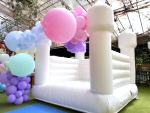 White Bouncy Castle with Organic Balloon Decor 1