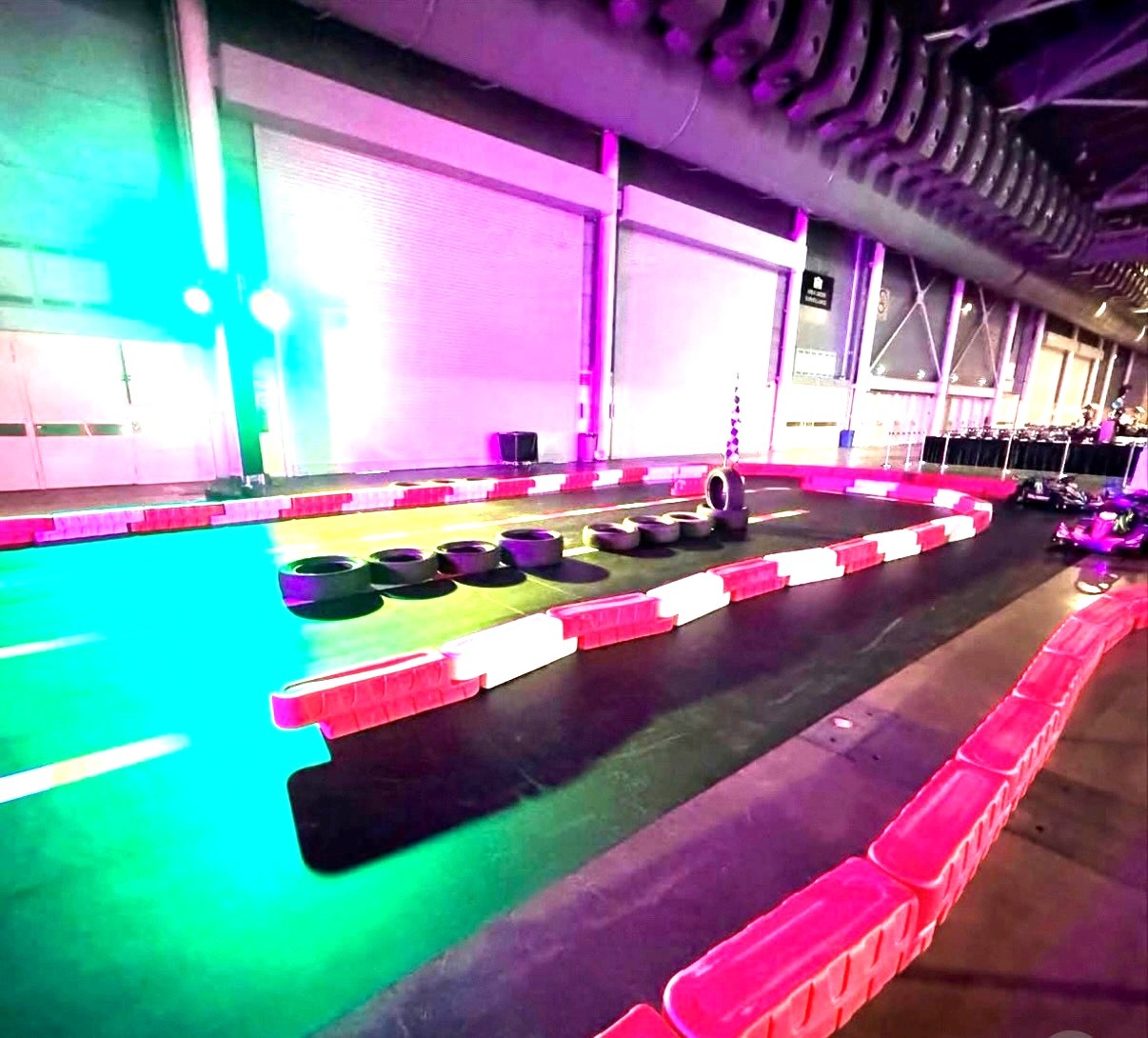 Indoor go-kart track with neon lights carnival ride rental Singapore