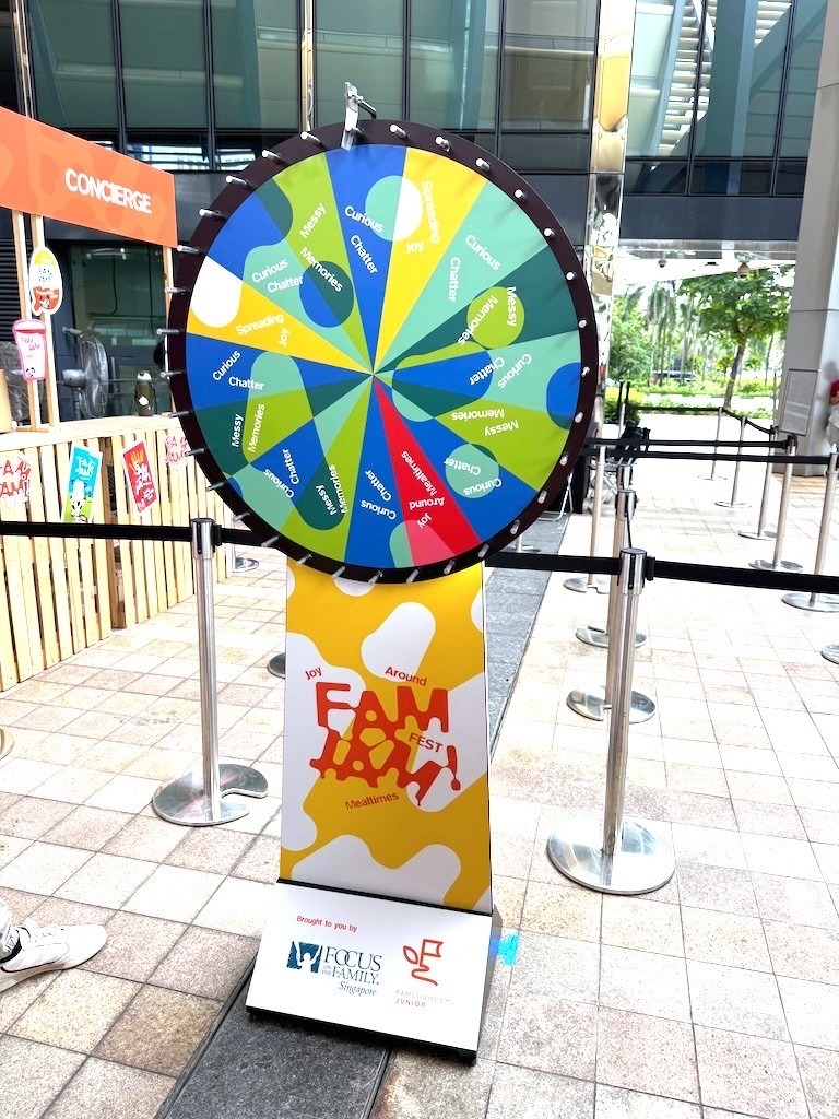 Spin the wheel Lucky Draw Singapore game at a carnival-themed event