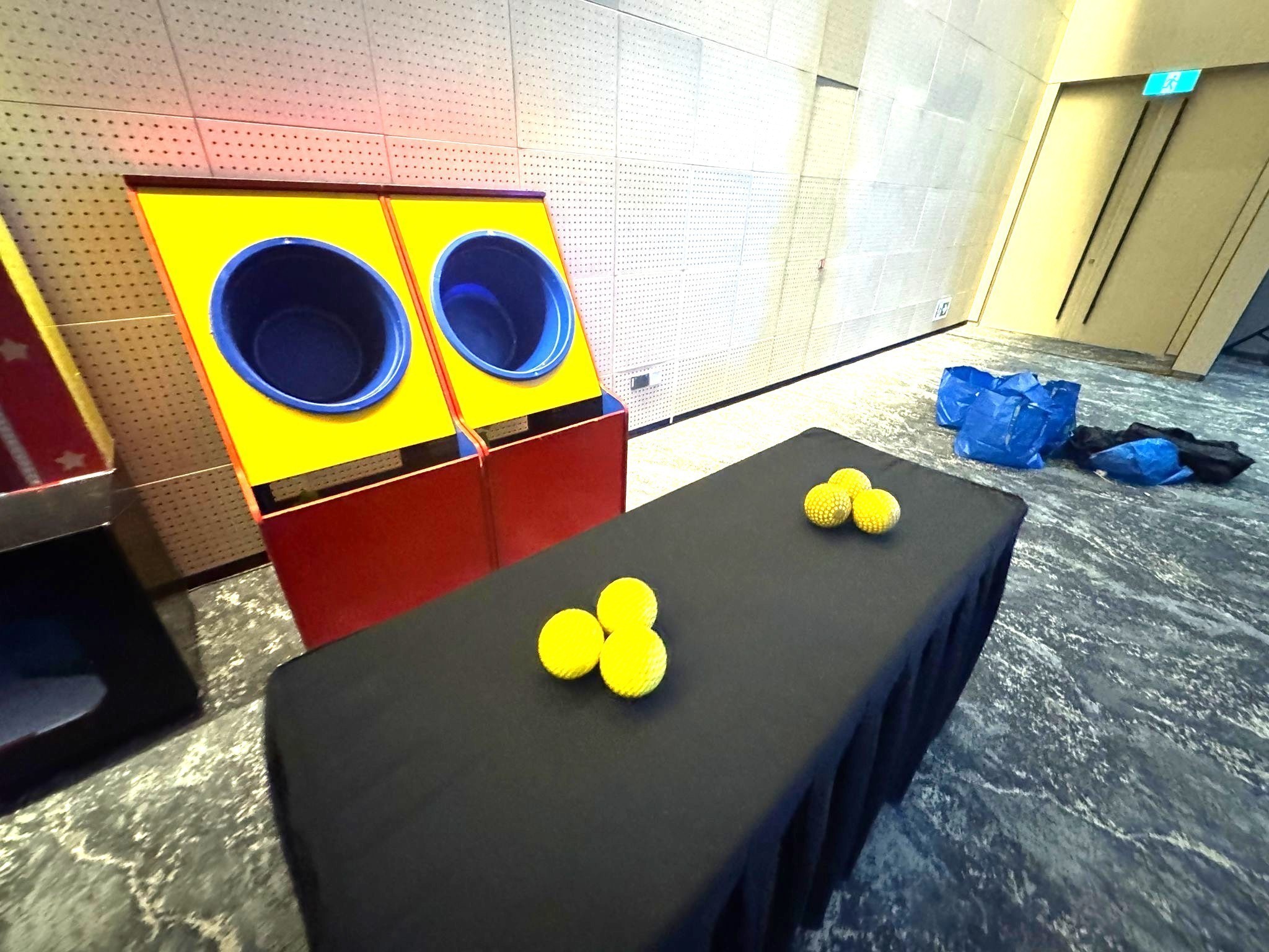 Ball toss bucket carnival game rental at a corporate event in Singapore