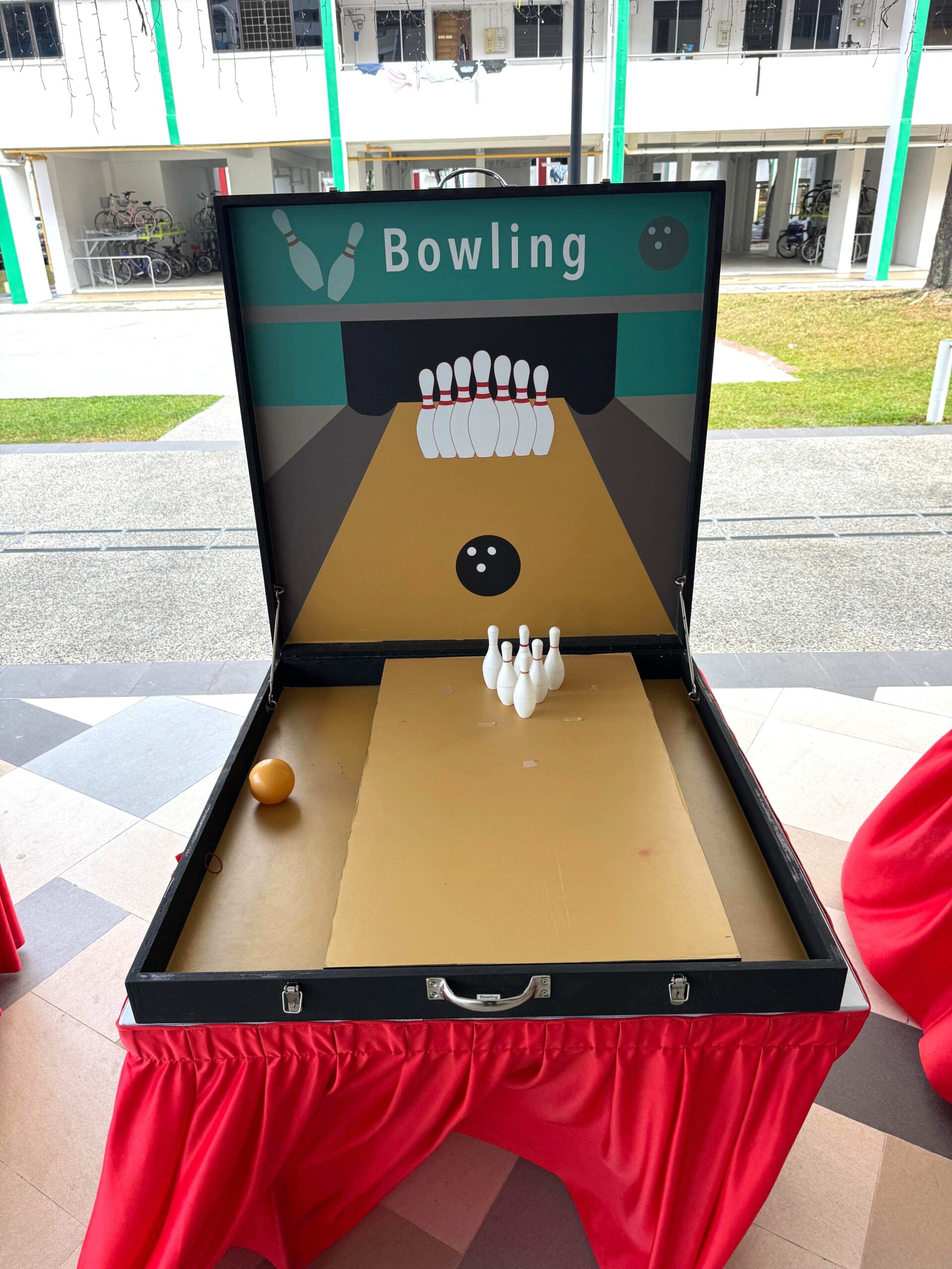 Mini bowling lane carnival game rental at a Singapore event
