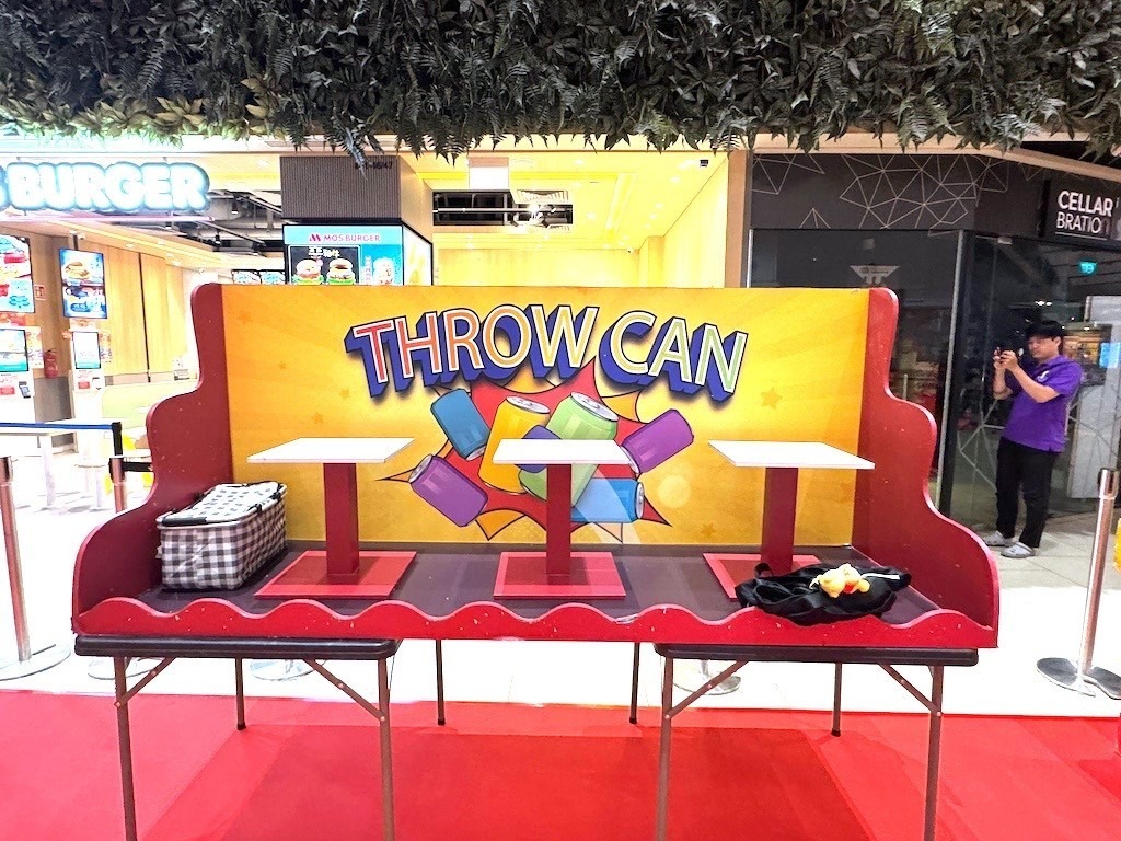Throw the Can carnival game booth rental for a mall event in Singapore