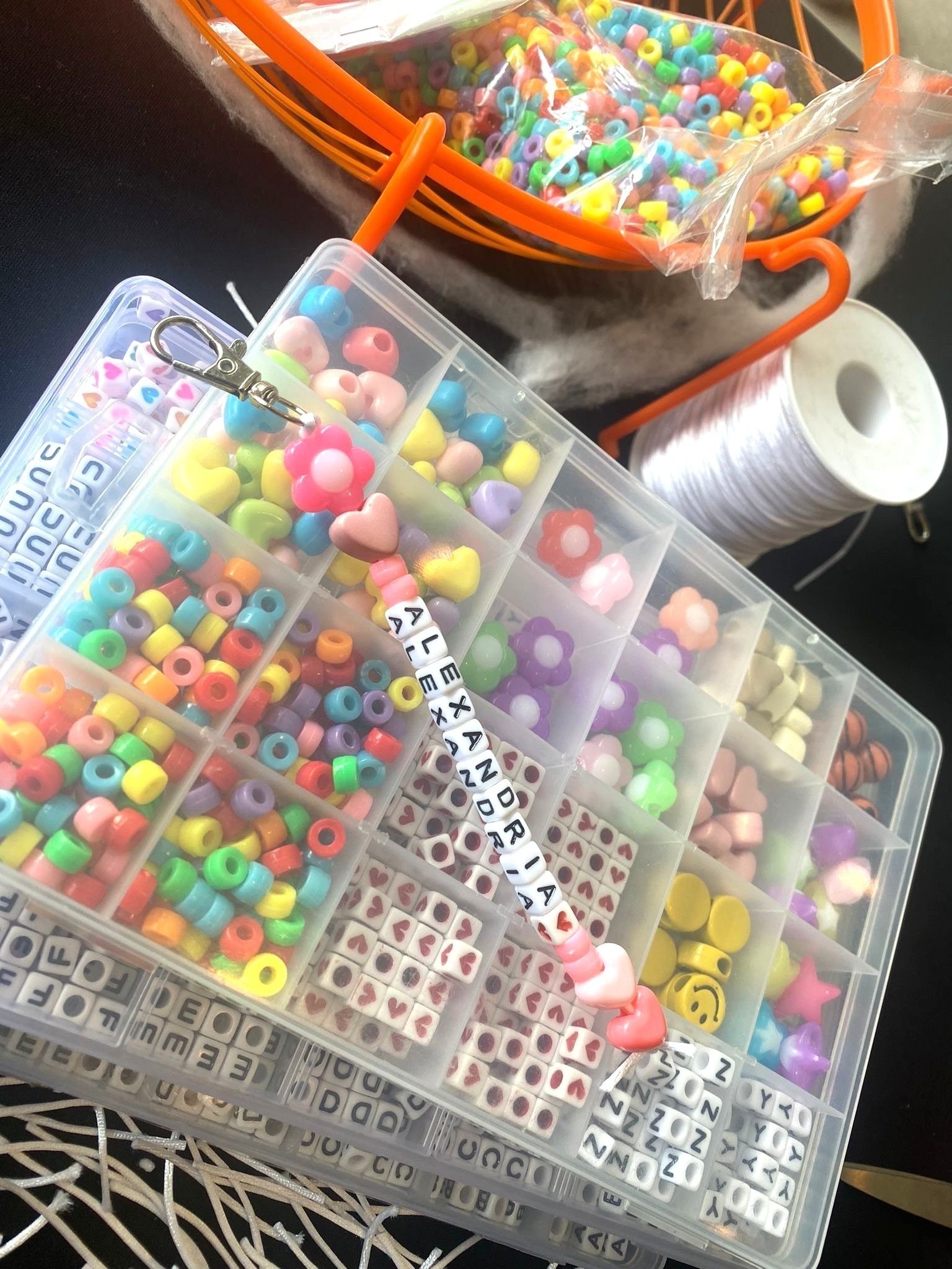 Bead bracelet and keychain making fringe activity at Singapore event