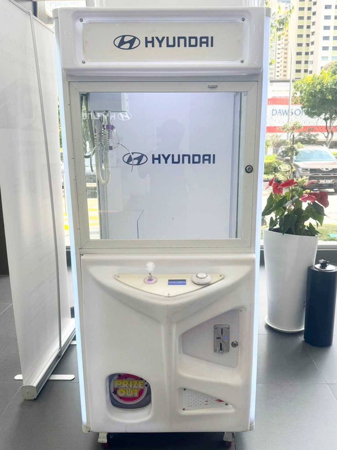 Branded Hyundai claw machine rental for a corporate event in Singapore