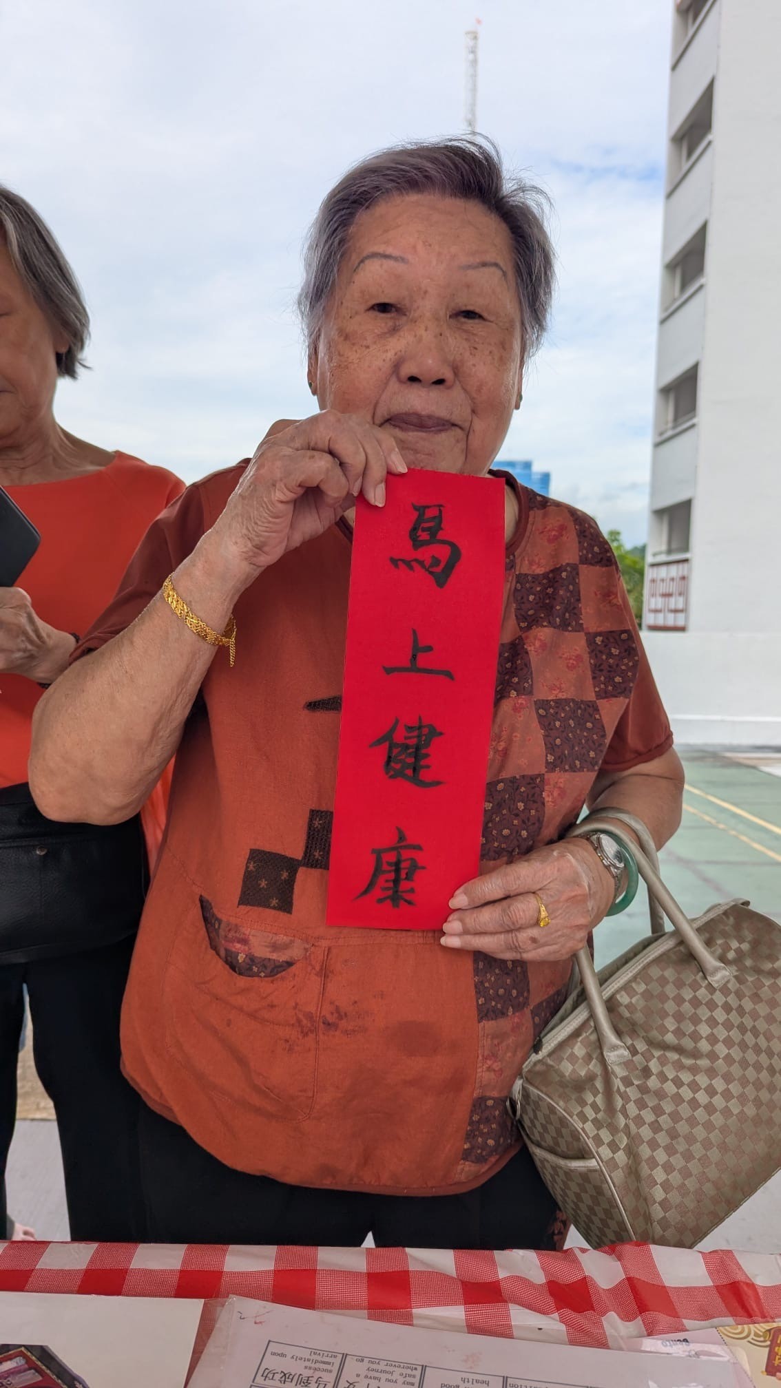 Chinese calligraphy CNY fringe activity at community event in Singapore