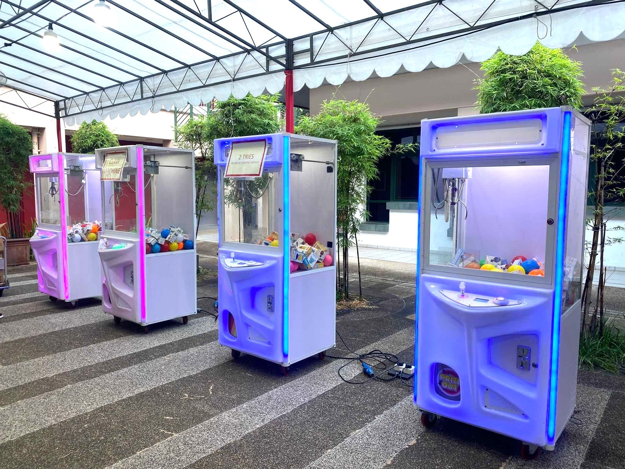 Claw machine rental at an outdoor event in Singapore