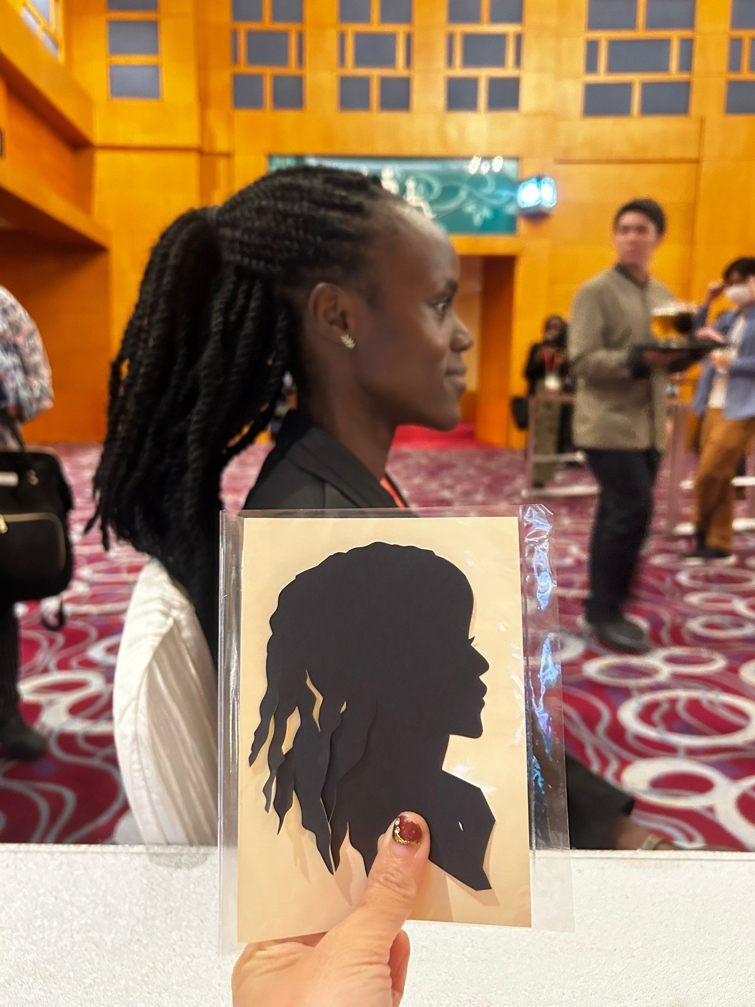 Silhouette cutting artist at corporate fringe activity event in Singapore