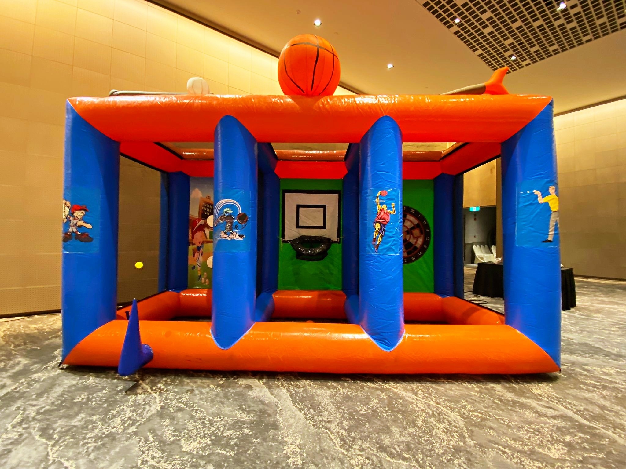 Bouncy Castle Rental: 6 Smart Ways to Choose for Your Event 6 Basketball themed inflatable play area in an indoor venue