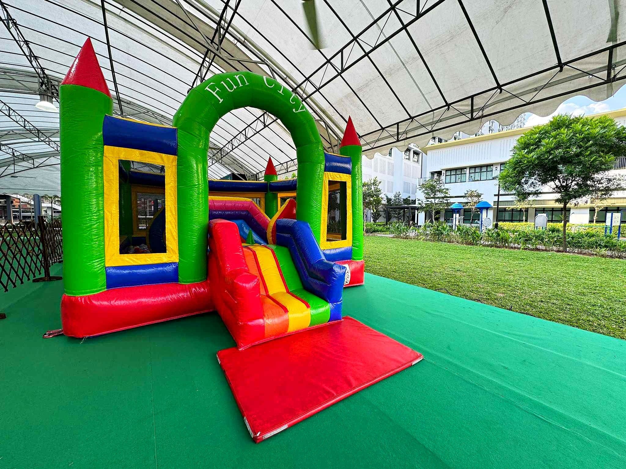 Bouncy Castle Rental: 6 Smart Ways to Choose for Your Event 10 Fun City inflatable castle beneath a canopy
