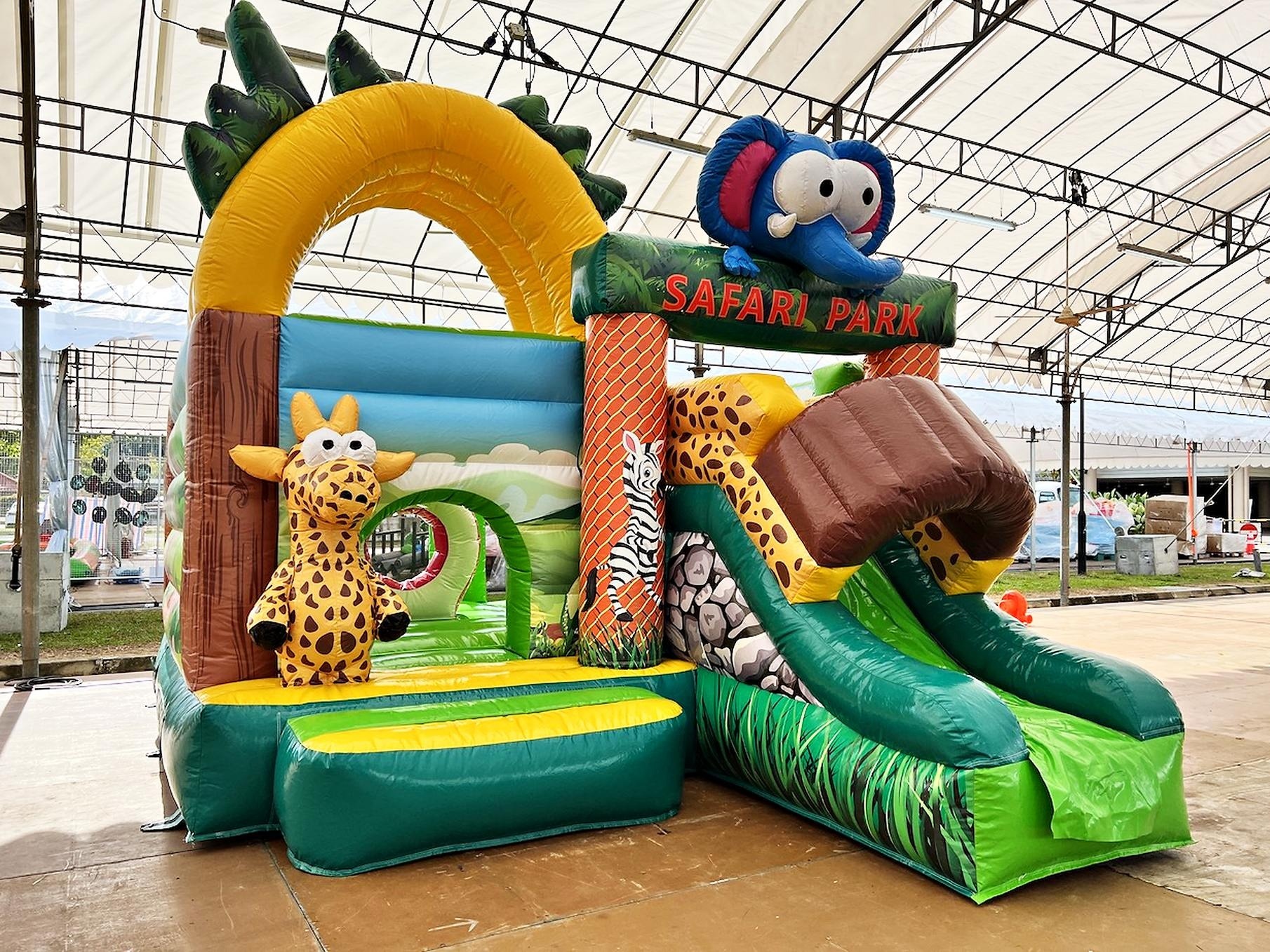 Bouncy Castle Rental: 6 Smart Ways to Choose for Your Event 11 Safari Park bouncy castle with a green slide