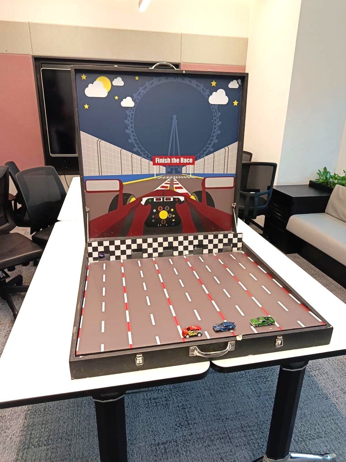 Carnival Games Singapore: A Family-Day Stamp Card Plan 10 Finish the Race tabletop carnival game with miniature cars at a Singapore corporate event