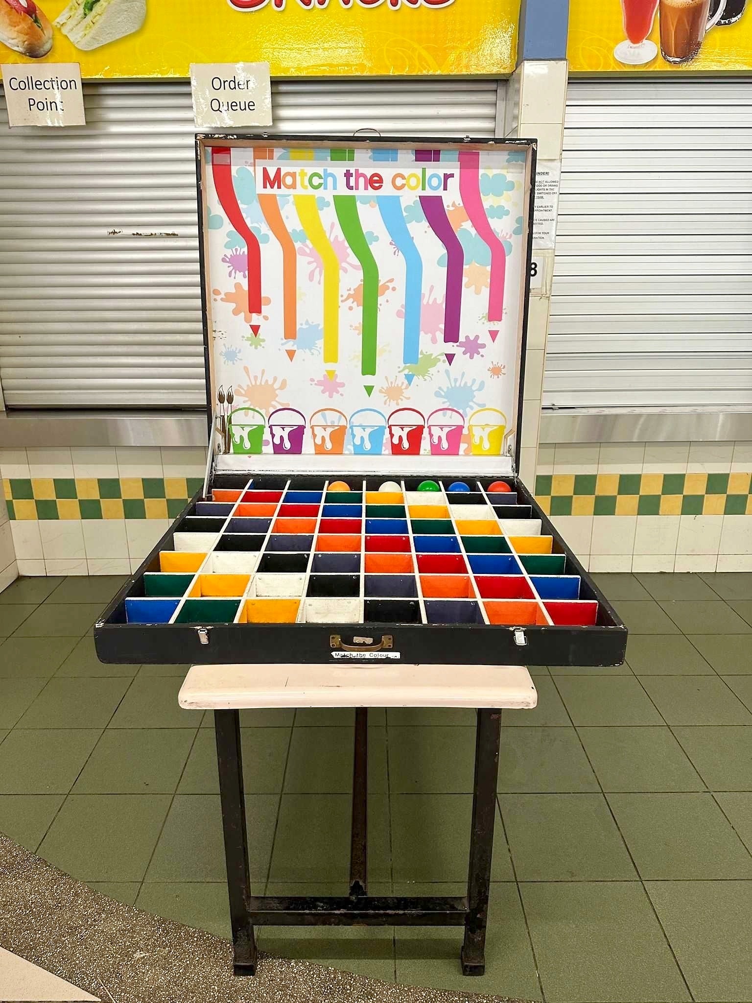 Carnival Games Singapore: A Family-Day Stamp Card Plan 8 Match the Colour carnival game with a colourful board and divided target tray