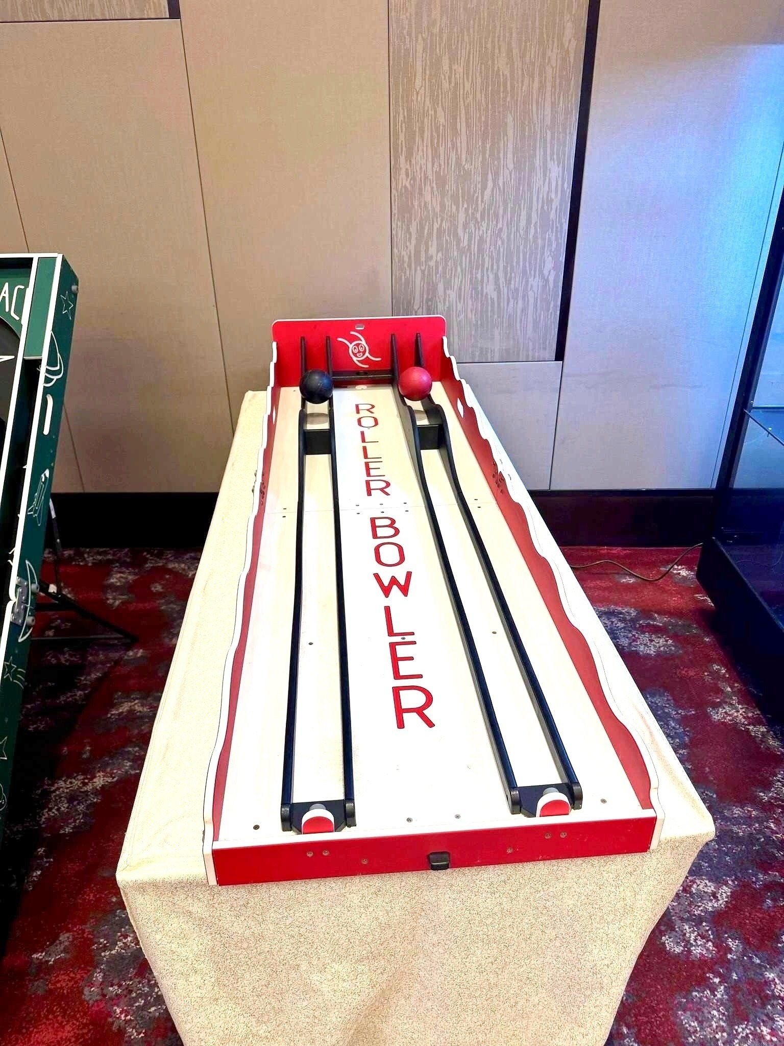 Carnival Games Singapore: A Family-Day Stamp Card Plan 2 Roller Bowler carnival game with two ball-rolling lanes at an indoor event