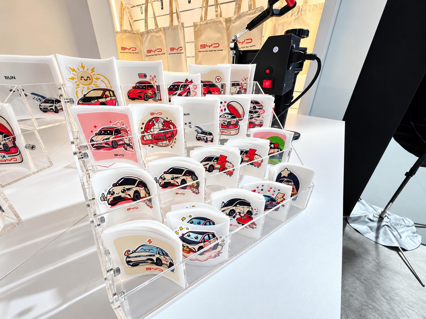 Custom Tote Bag Fringe Activity 3 Colourful car transfer designs displayed for guests to choose