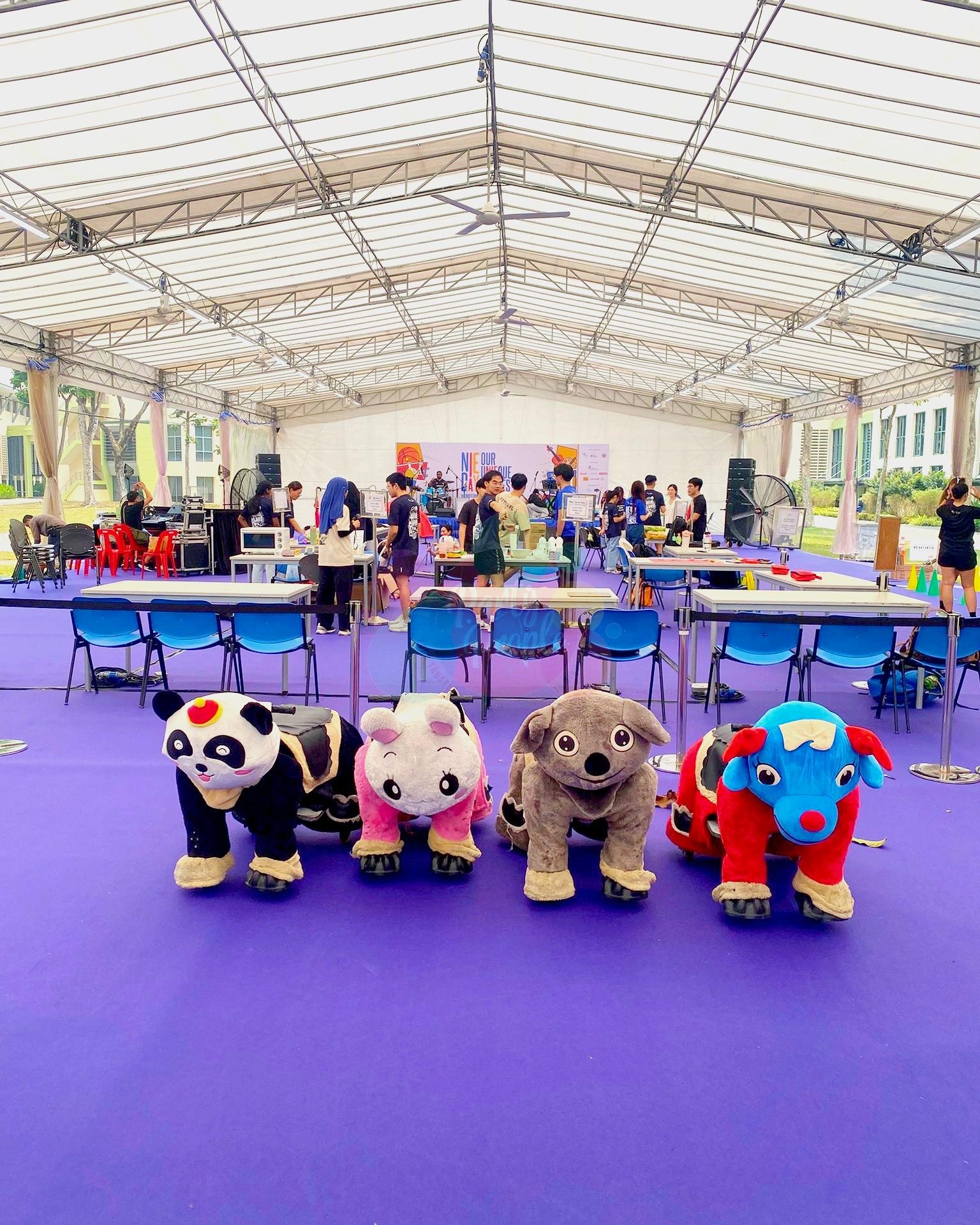 Carnival Rides for a Family Day: Trains, Animal Rides and Go-Karts 3 Animal rides lined up inside an event marquee
