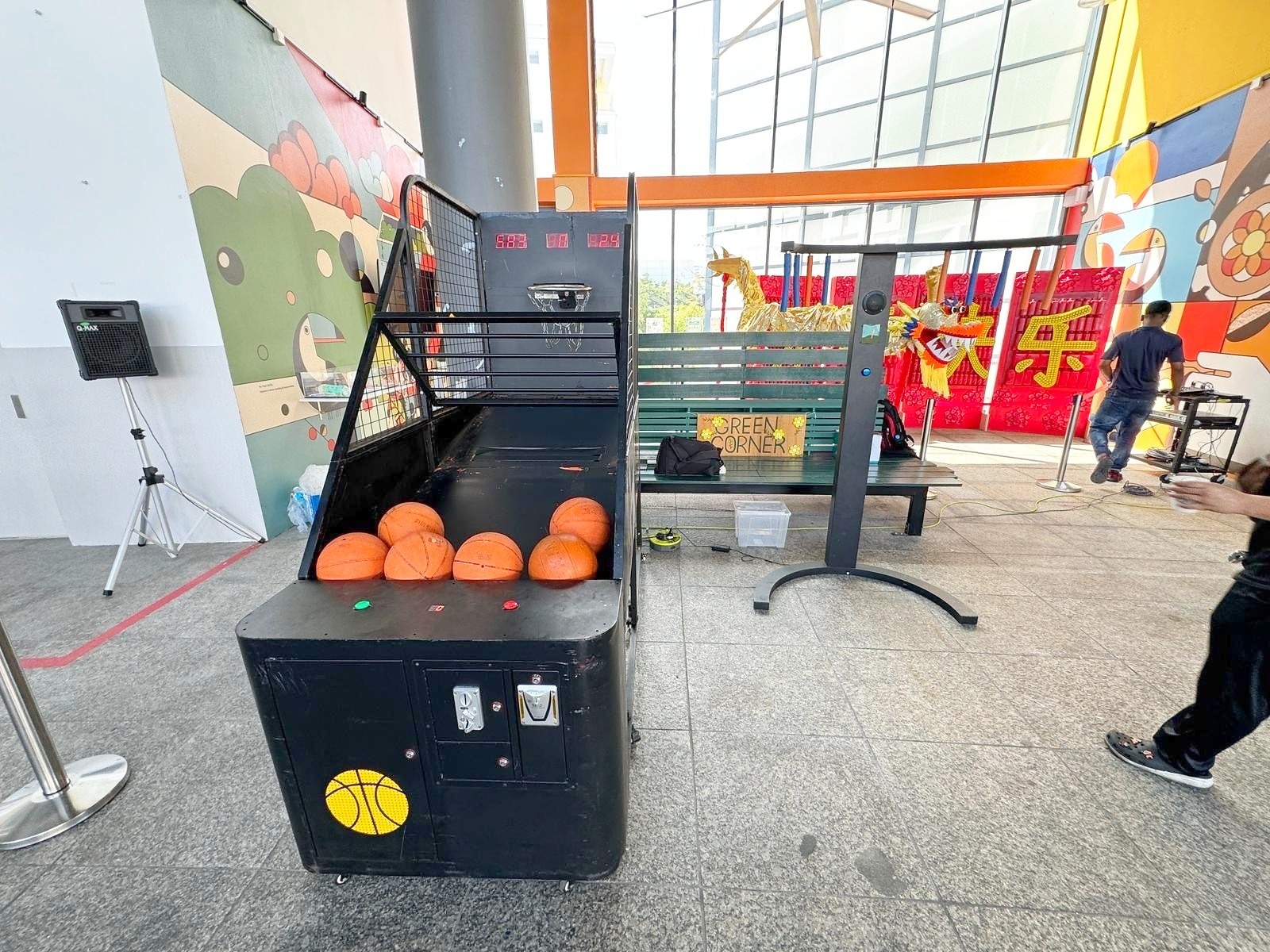 Arcade Party Ideas: From a Neon Games Room to a Racing Lounge 4 Basketball arcade game beside a festive event display