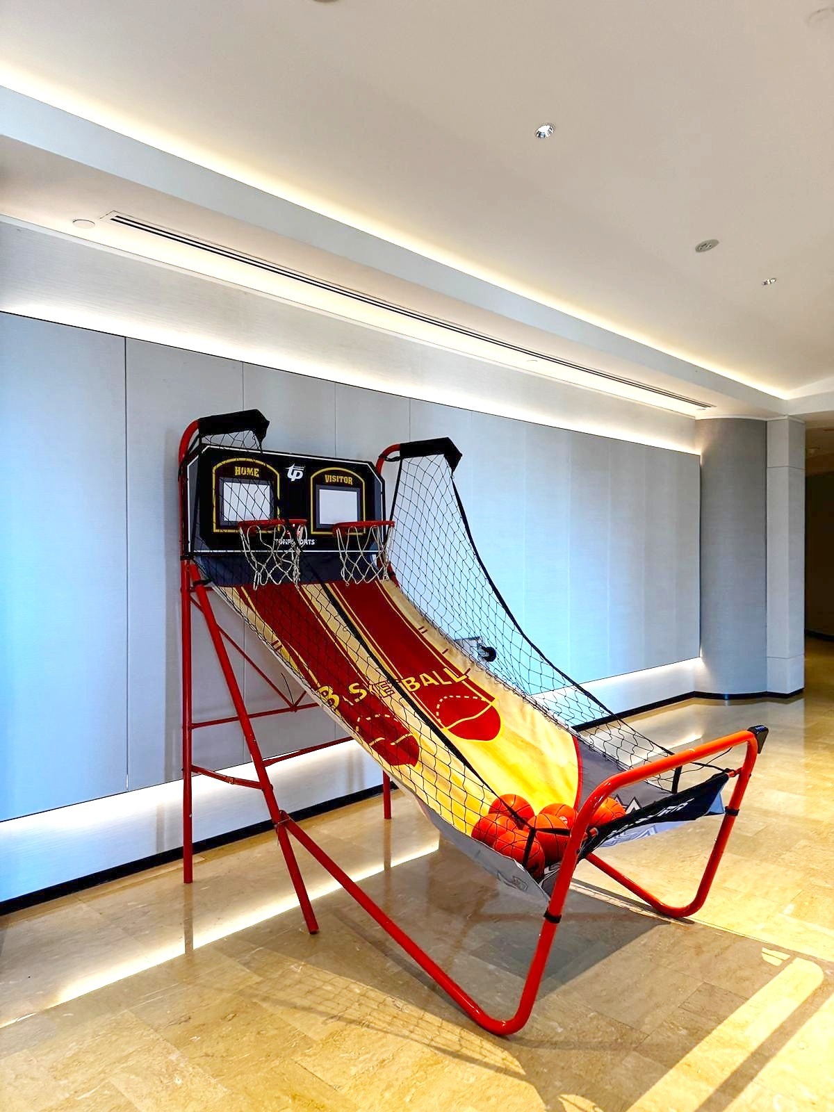 Arcade Party Ideas: From a Neon Games Room to a Racing Lounge 10 Basketball shooting game set up inside an event room