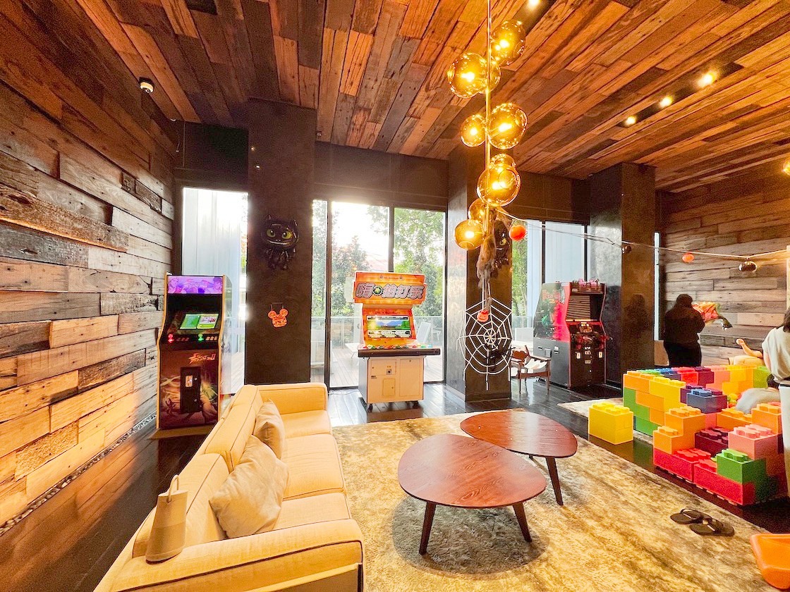 Arcade Party Ideas: From a Neon Games Room to a Racing Lounge 7 Arcade cabinets beside lounge seating in a private event room