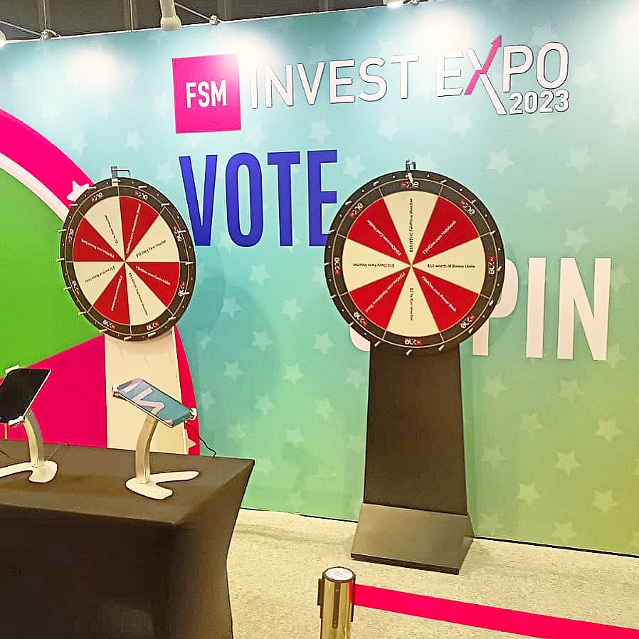 Prize Wheel Artwork: Making Every Segment Easy to Read 7 Two red and white prize wheels against an exhibition backdrop
