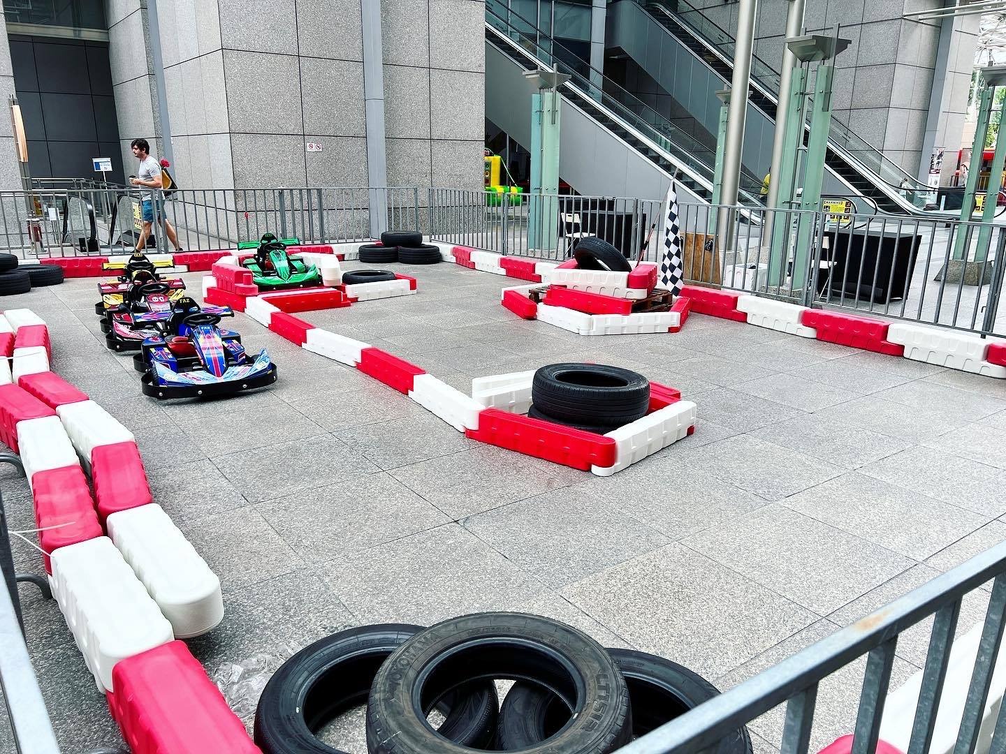 Carnival Rides for a Family Day: Trains, Animal Rides and Go-Karts 10 Go-kart circuit beside a building entrance
