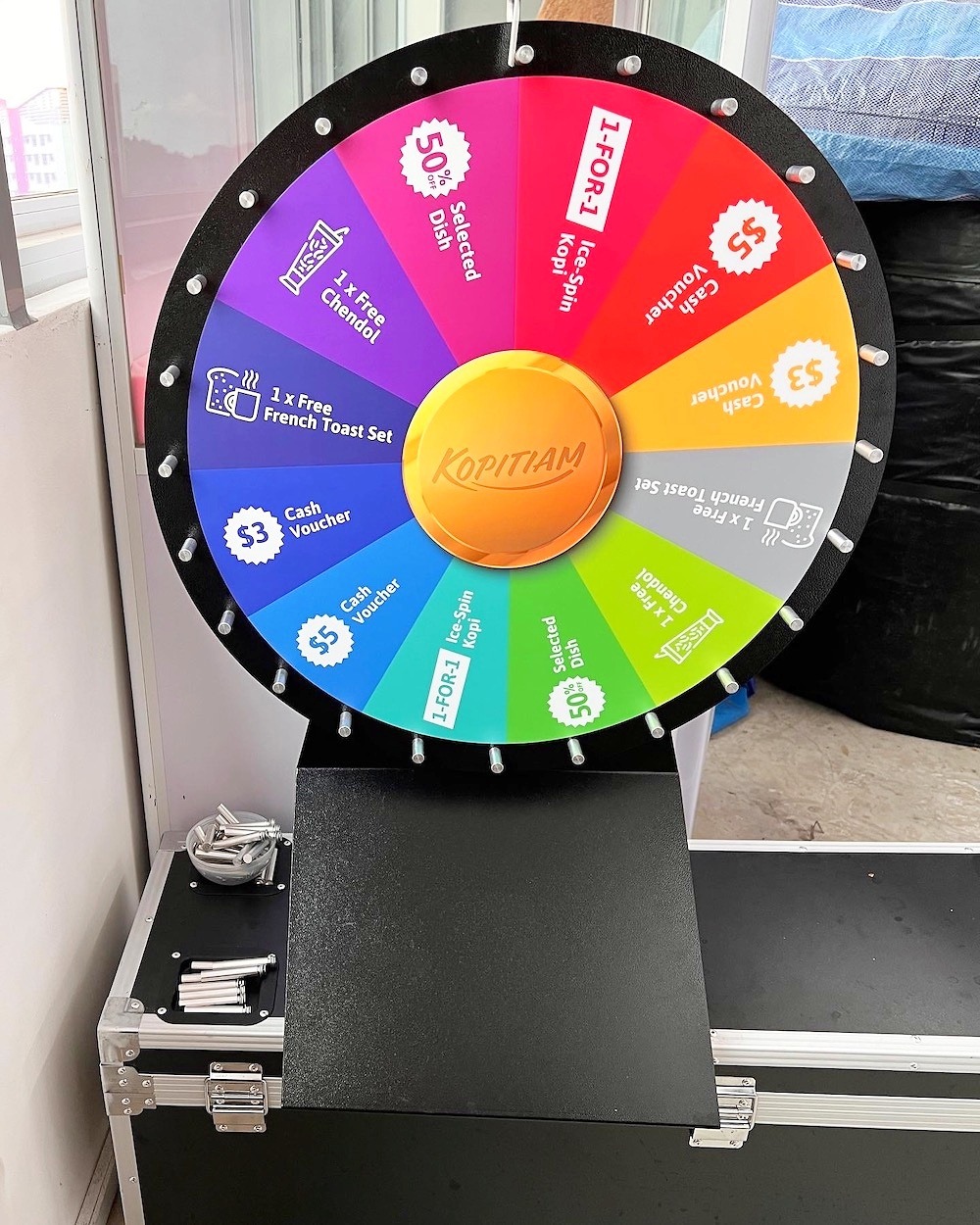 Prize Wheel Artwork: Making Every Segment Easy to Read 5 Tabletop prize wheel with colourful segments and a compact black base